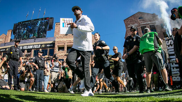 BOULDER, CO - SEPTEMBER 09: Colorado head coach Deion Sanders leads his players onto the field during the home opener game between the Colorado Buffaloes and the the Nebraska Cornhuskers on Saturday, September 9, 2023 at Folsom Field in Boulder, CO.