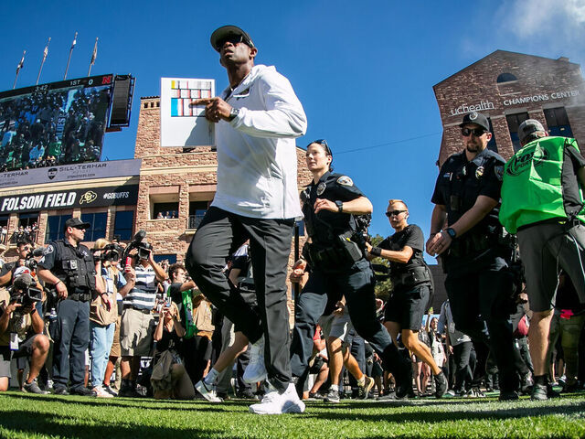 BOULDER, CO - SEPTEMBER 09: Colorado head coach Deion Sanders leads his players onto the field during the home opener game between the Colorado Buffaloes and the the Nebraska Cornhuskers on Saturday, September 9, 2023 at Folsom Field in Boulder, CO.