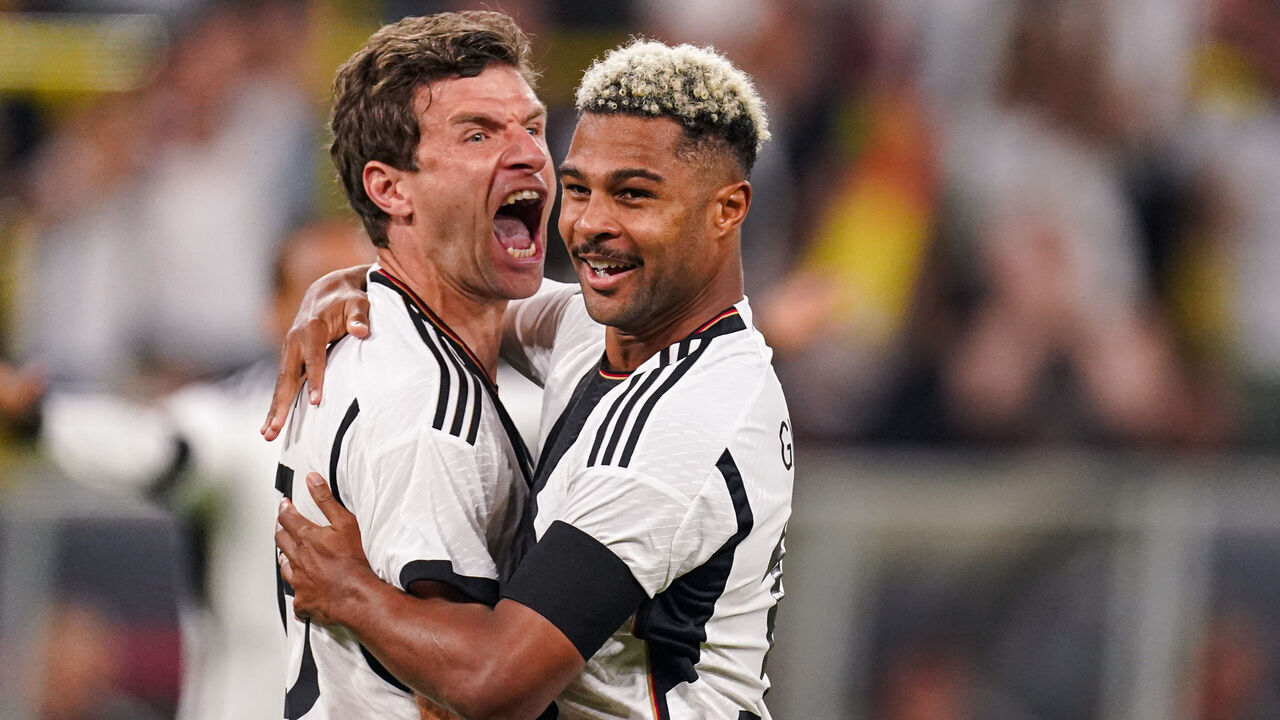 DORTMUND, GERMANY - SEPTEMBER 12: Emre Can of Germany celebrates after scoring his teams first goal, Serge Gnabry of Germany during the International Friendly match between Germany and France at Signal Iduna Park on September 12, 2023 in Dortmund, Germany.