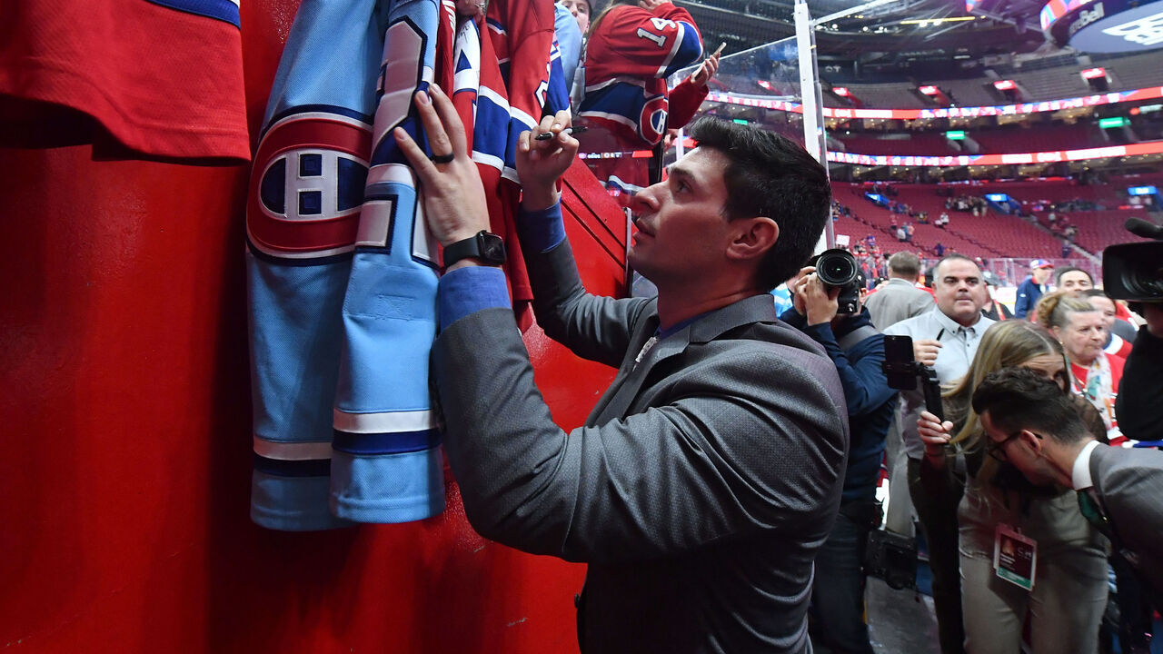 MONTREAL, CANADA - APRIL 13: Carey Price #31 of the Montreal Canadiens signs autographs for fans after the NHL game against the Boston Bruins at the Centre Bell on April 13, 2023 in Montreal, Quebec, Canada.