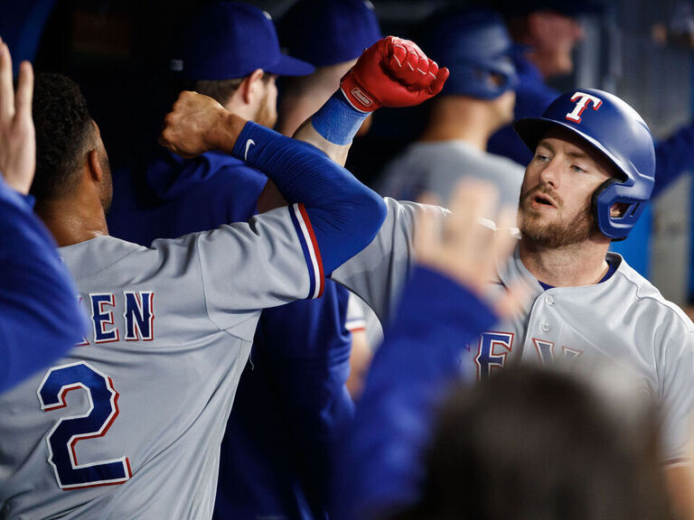 Heim, Carter help Rangers hammer Blue Jays to start crucial series