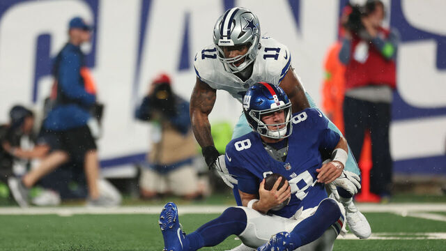 EAST RUTHERFORD, NEW JERSEY - SEPTEMBER 10: Micah Parsons #11 of the Dallas Cowboys sacks Daniel Jones #8 of the New York Giants during the first quarter at MetLife Stadium on September 10, 2023 in East Rutherford, New Jersey.