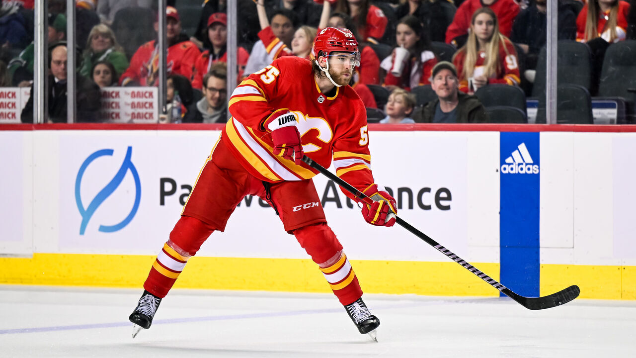CALGARY, AB - MARCH 18: Calgary Flames Defenceman Noah Hanifin (55) passes the puck during the third period of an NHL game between the Calgary Flames and the Dallas Stars on March 18, 2023, at the Scotiabank Saddledome in Calgary, AB.