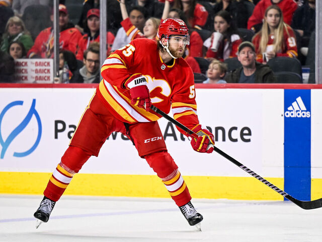 CALGARY, AB - MARCH 18: Calgary Flames Defenceman Noah Hanifin (55) passes the puck during the third period of an NHL game between the Calgary Flames and the Dallas Stars on March 18, 2023, at the Scotiabank Saddledome in Calgary, AB.
