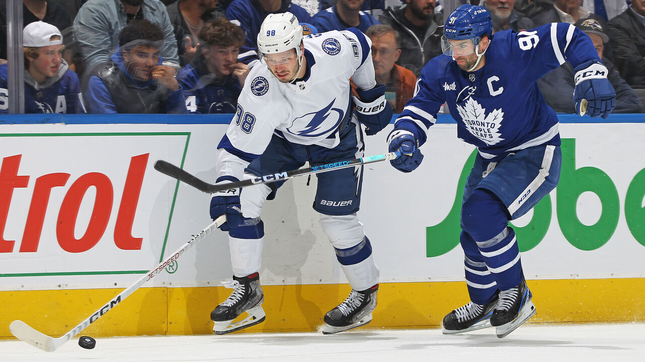 TORONTO, CANADA - APRIL 27: Mikhail Sergachev #98 of the Tampa Bay Lightning battles for the puck against John Tavares #91 of the Toronto Maple Leafs during Game Five of the First Round of the 2023 Stanley Cup Playoffs at Scotiabank Arena on April 27, 2023 in Toronto, Ontario, Canada. The Lightning defeated the Maple Leafs 4-2.