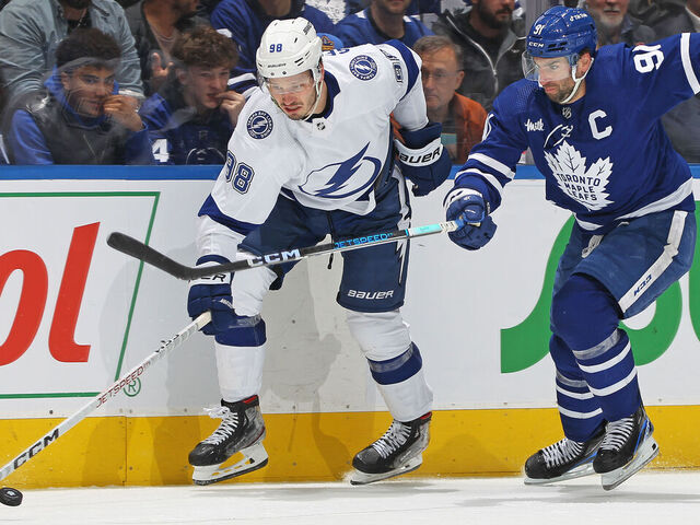 TORONTO, CANADA - APRIL 27: Mikhail Sergachev #98 of the Tampa Bay Lightning battles for the puck against John Tavares #91 of the Toronto Maple Leafs during Game Five of the First Round of the 2023 Stanley Cup Playoffs at Scotiabank Arena on April 27, 2023 in Toronto, Ontario, Canada. The Lightning defeated the Maple Leafs 4-2.