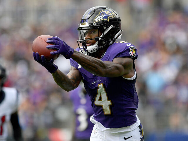 BALTIMORE, MD - SEPTEMBER 10: Ravens wide receiver/punt returner Zay Flowers (4) catches a deep pass during the first quarter during the Houston Texans versus Baltimore Ravens NFL game at M&T Bank Stadium on September 10, 2023 in Baltimore, MD.