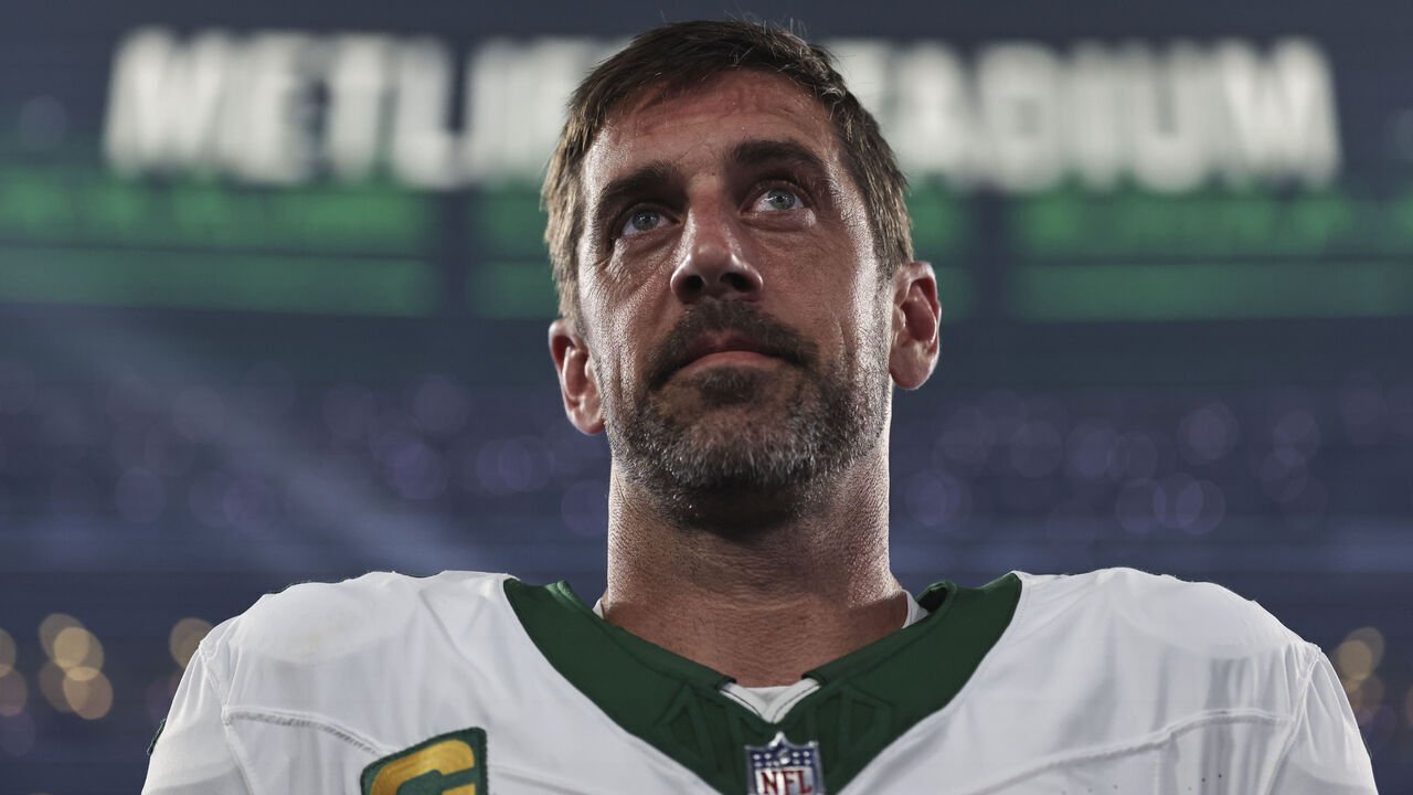 EAST RUTHERFORD, NEW JERSEY - SEPTEMBER 11: Aaron Rodgers #8 of the New York Jets looks on during the national anthem prior to a game against the Buffalo Bills at MetLife Stadium on September 11, 2023 in East Rutherford, New Jersey.