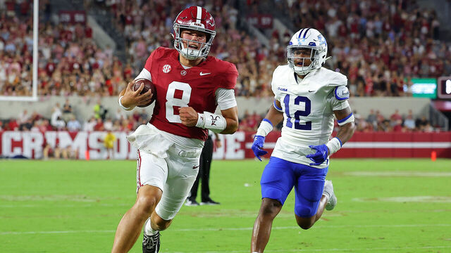 TUSCALOOSA, ALABAMA - SEPTEMBER 02: Tyler Buchner #8 of the Alabama Crimson Tide rushes for a touchdown against Jalen Davis #12 of the Middle Tennessee Blue Raiders during the fourth quarter at Bryant-Denny Stadium on September 02, 2023 in Tuscaloosa, Alabama.