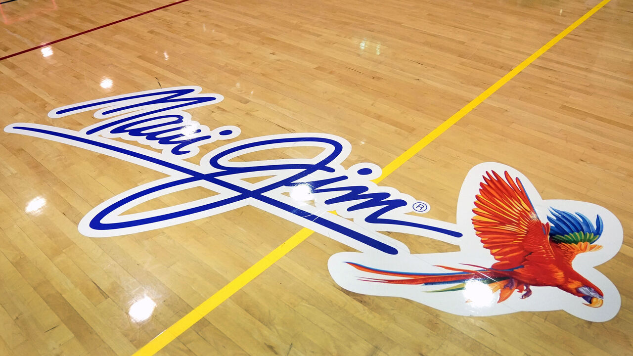 LAHAINA, HI - NOVEMBER 22: The Maui Jim logo on the floor during a second round game of the Maui Jim Invitational college basketball Tournament between the Arkansas Razorbacks and the Arkansas Razorbacks at Lahaina Civic Arena on November 22, 2022 in Lahaina, Hawaii.