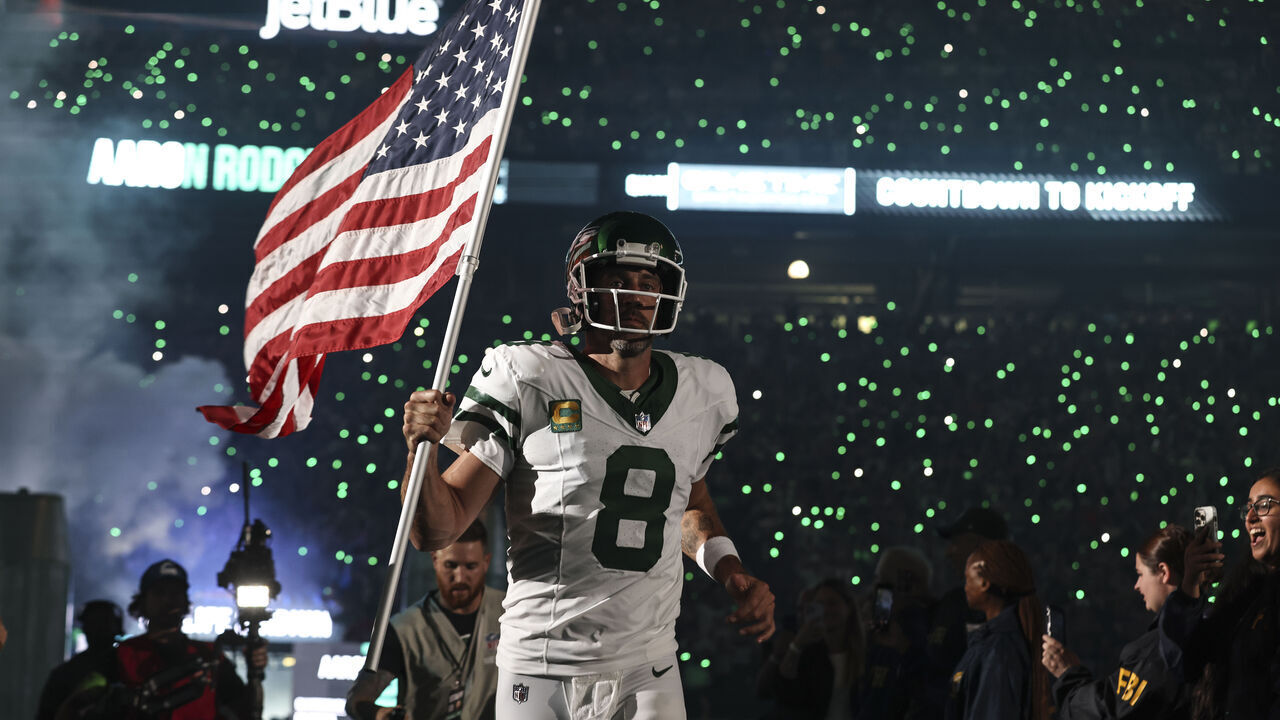 EAST RUTHERFORD, NEW JERSEY - SEPTEMBER 11: Aaron Rodgers #8 of the New York Jets takes the field prior to a game against the Buffalo Bills at MetLife Stadium on September 11, 2023 in East Rutherford, New Jersey.
