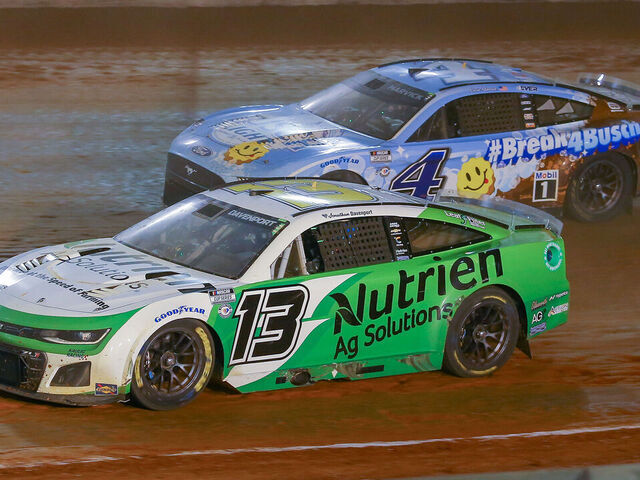 BRISTOL, TN - APRIL 09: NASCAR Cup Series driver Jonathan Davenport (13) passes NASCAR Cup Series driver Kevin Harvick (4) during the Food City Dirt Race on April 9, 2023 at Bristol Motor Speedway in Bristol, TN.
