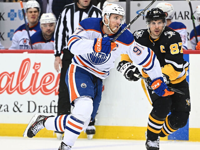 PITTSBURGH, PA - FEBRUARY 23: Connor McDavid #97 of the Edmonton Oilers skates against Sidney Crosby #87 of the Pittsburgh Penguins in the second period during the game at PPG PAINTS Arena on February 23, 2023 in Pittsburgh, Pennsylvania.