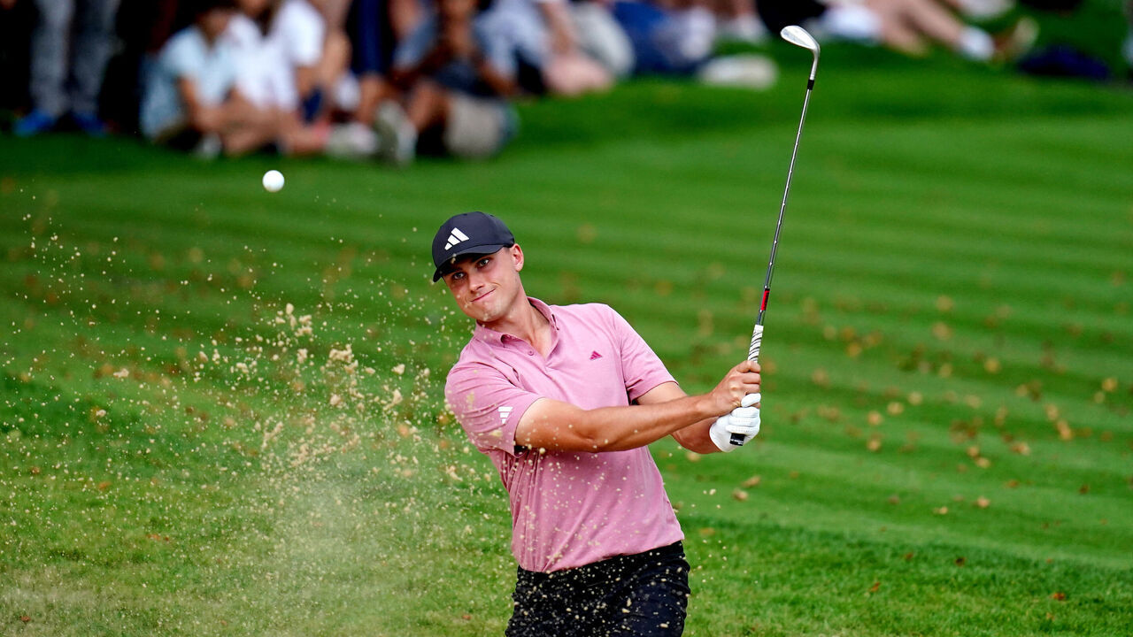 Ludvig Åberg plays out of a bunker on the 18th during day three of the 2023 BMW PGA Championship at Wentworth Golf Club in Virginia Water, Surrey. Picture date: Saturday September 16, 2023.