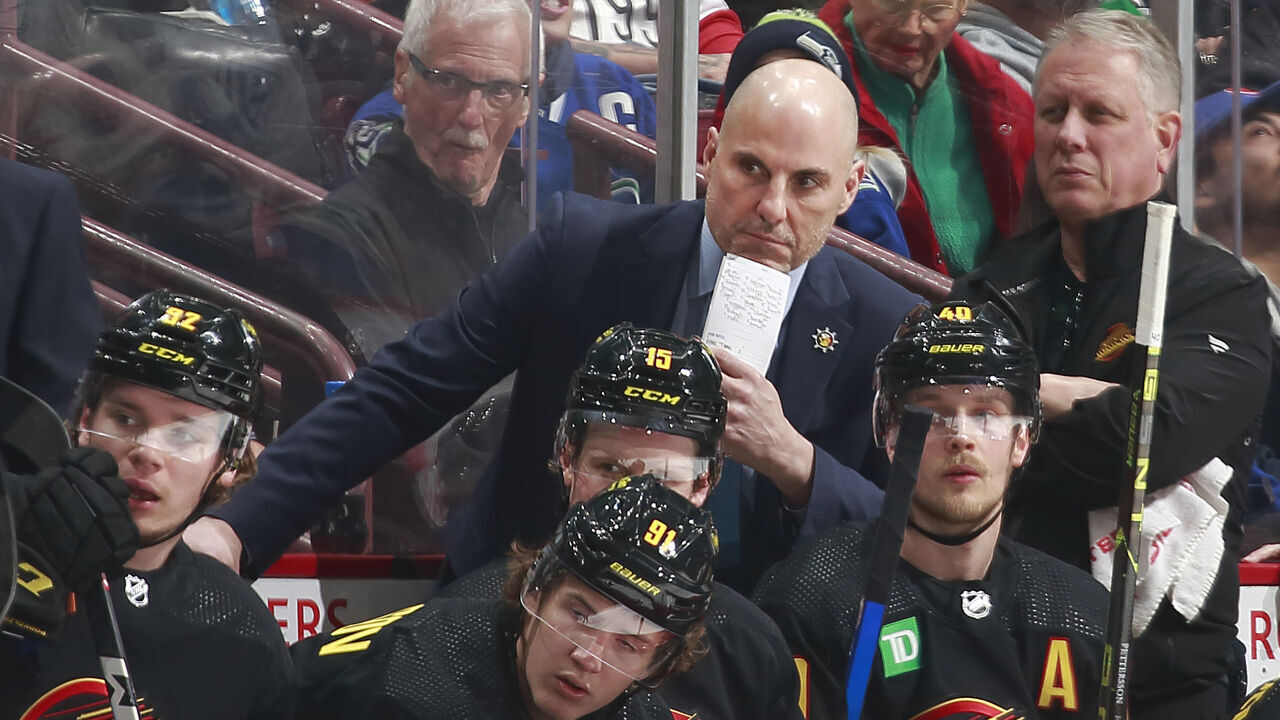VANCOUVER, CANADA - MARCH 2: Head coach Rick Tocchet of the Vancouver Canucks looks on from the bench during their NHL game against the Minnesota Wild at Rogers Arena March 2, 2023 in Vancouver, British Columbia, Canada.