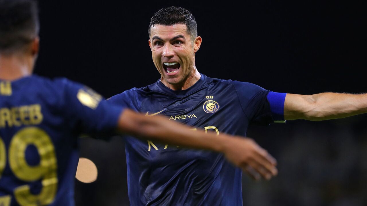 Nassr's Portuguese forward #07 Cristiano Ronaldo (R) celebrates with Nassr's Saudi midfielder #29 Abdulrahman Ghareeb after scoring a goal during the Saudi Pro League football match between Al-Nassr and Al-Hazem at the King Abdullah Sports City in Buraidah, on September 2, 2023.