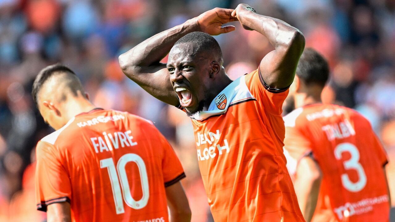 TOPSHOT - Lorient's French defender #05 Benjamin Mendy reacts after his team's second goal by Lorient's French midfielder #10 Romain Faivre during the French L1 football match between FC Lorient and AS Monaco at Stade du Moustoir in Lorient, western France on September 17, 2023.