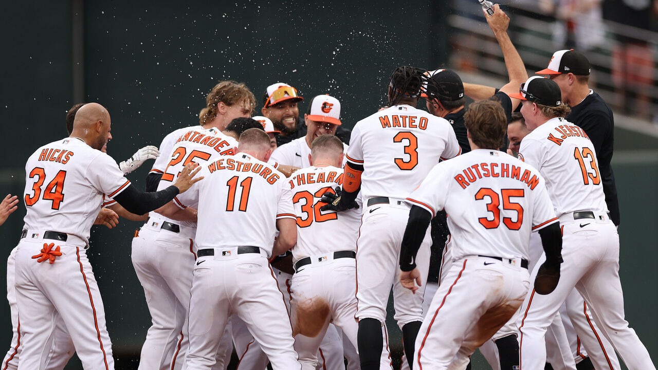BALTIMORE, MARYLAND - SEPTEMBER 17: Cedric Mullins #31 of the Baltimore Orioles celebrates with teammates after hitting a sacrifice RBI against the Tampa Bay Rays during the eleventh inning at Oriole Park at Camden Yards on September 17, 2023 in Baltimore, Maryland.