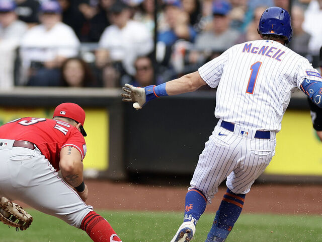 NEW YORK, NY - SEPTEMBER 17: Jeff McNeil #1 of the New York Mets is safe at first base after a fielding error by Christian Encarnacion-Strand #33 of the Cincinnati Reds during the fifth inning at Citi Field on September 17, 2023 in New York City.