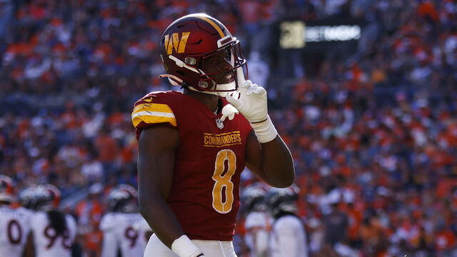 DENVER, COLORADO - SEPTEMBER 17: Brian Robinson Jr. #8 of the Washington Commanders celebrates after scoring a rushing touchdown during the fourth quarter against the Denver Broncos at Empower Field At Mile High on September 17, 2023 in Denver, Colorado.