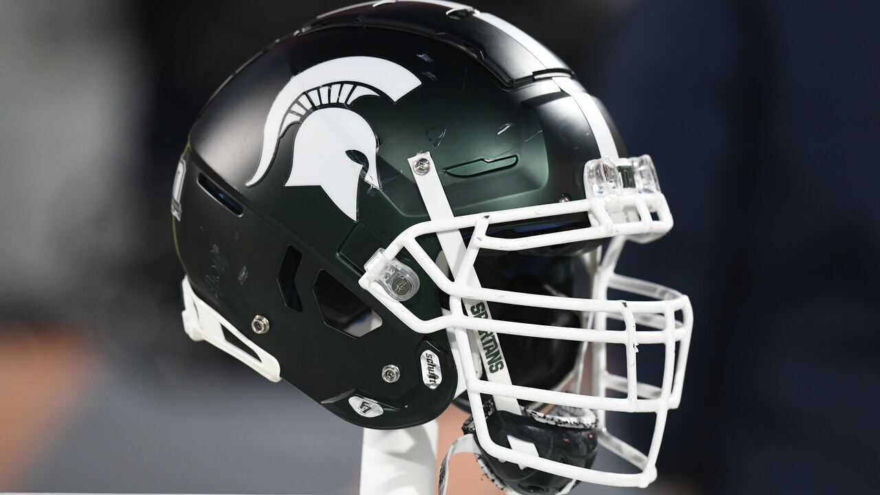 CHAMPAIGN, IL - NOVEMBER 05: A Michigan State Spartans helmet sits on the back of the team bench during the college football game between the Michigan State Spartans and the Illinois Fighting Illini on November 5, 2022, at Memorial Stadium in Champaign, Illinois.
