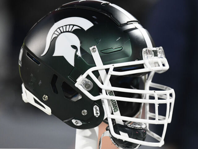 CHAMPAIGN, IL - NOVEMBER 05: A Michigan State Spartans helmet sits on the back of the team bench during the college football game between the Michigan State Spartans and the Illinois Fighting Illini on November 5, 2022, at Memorial Stadium in Champaign, Illinois.