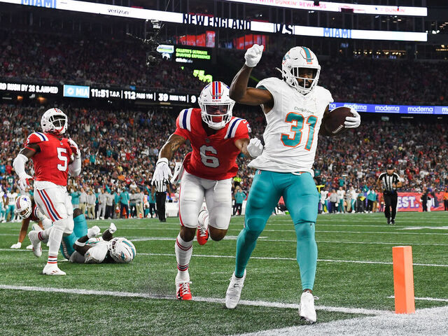 FOXBORO, MA - SEPTEMBER 17: Raheem Mostert #31 of the Miami Dolphins runs in for a touchdown during the second quarter against the New England Patriots at Gillette Stadium on September 17, 2023 in Foxboro, Massachusetts.