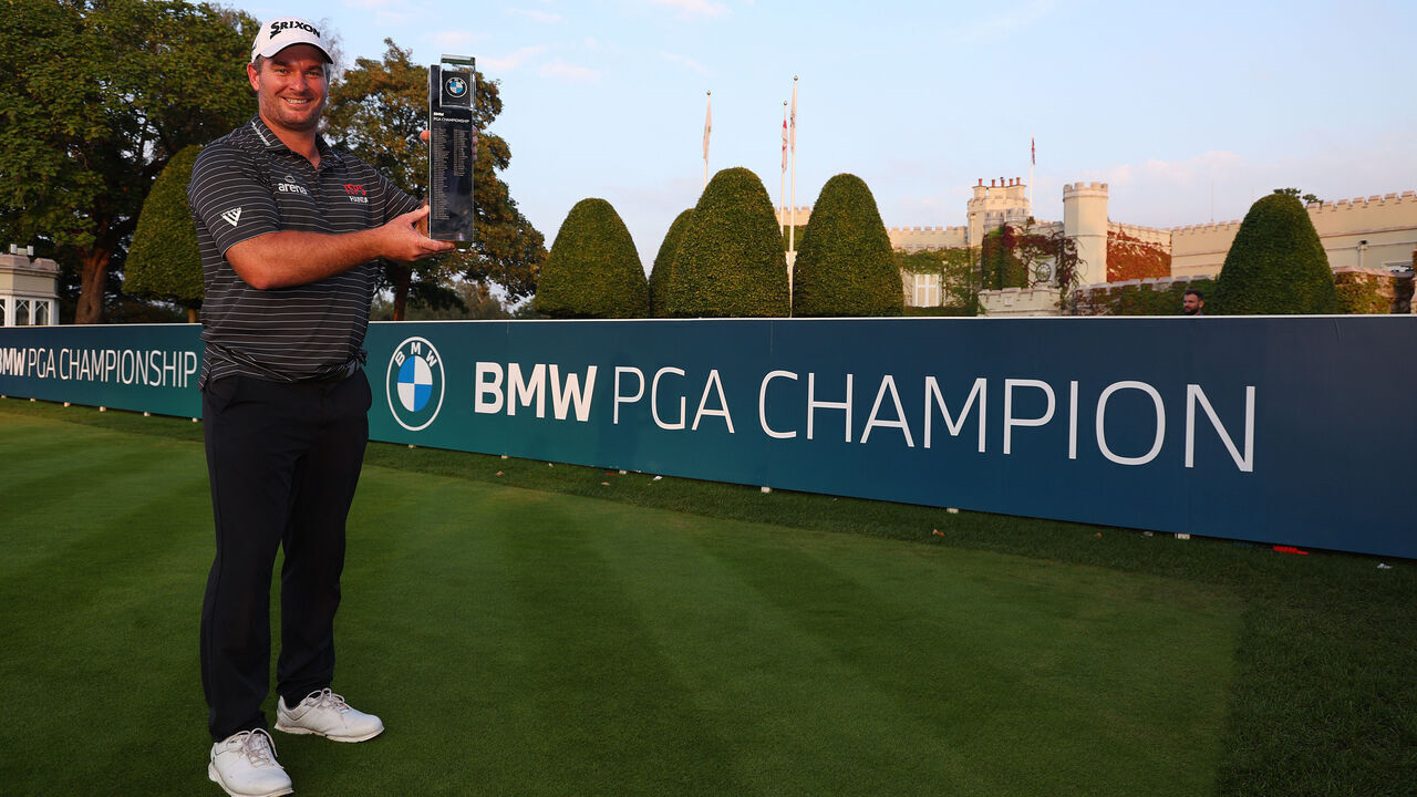 VIRGINIA WATER, ENGLAND - SEPTEMBER 17: Ryan Fox of New Zealand poses with the trophy on the 1st tee following victory on Day Four of the BMW PGA Championship at Wentworth Golf Club on September 17, 2023 in Virginia Water, England.