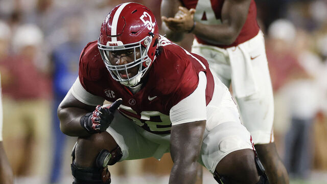 TUSCALOOSA, AL - SEPTEMBER 02: Alabama Crimson Tide offensive lineman Tyler Booker (52) lines up during a college football game against the Middle Tennessee Blue Raiders on September 02, 2023 at Bryant-Denny Stadium in Tuscaloosa, Alabama.