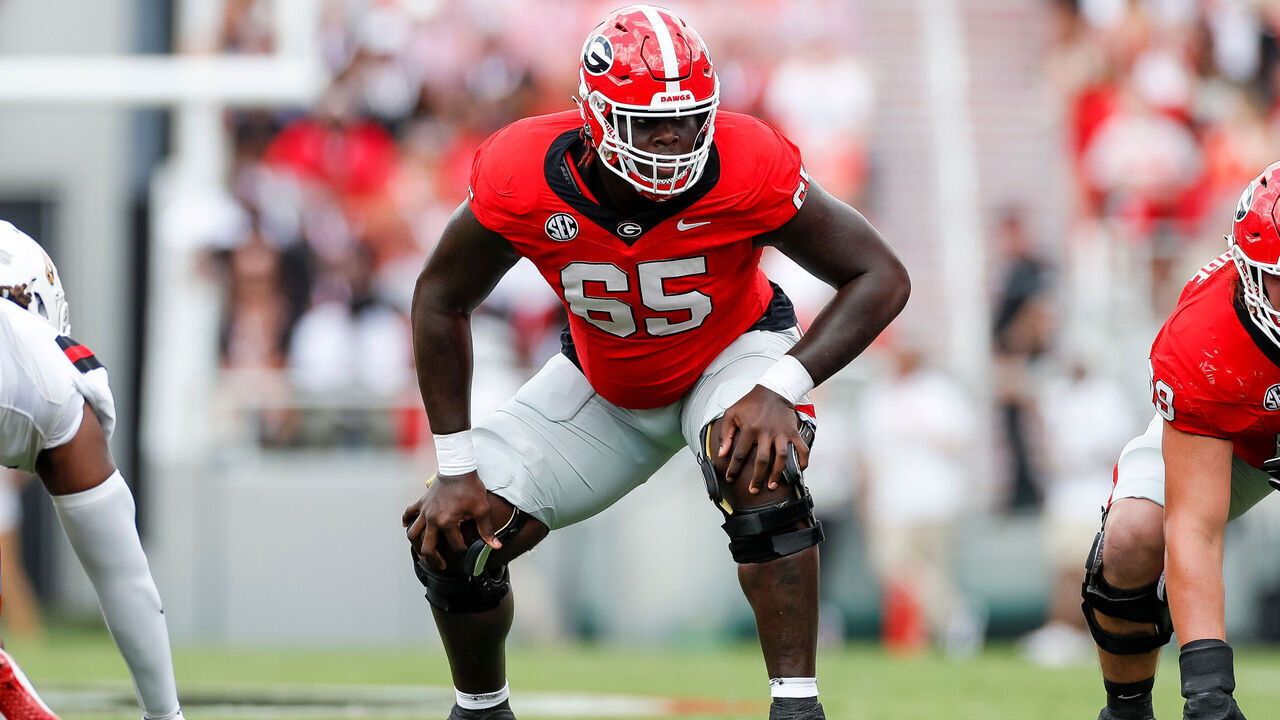 ATHENS, GEORGIA - SEPTEMBER 9: Amarius Mims #65 of the Georgia Bulldogs in an offensive stance during a game against the Ball State Cardinals at Sanford Stadium on September 9, 2023 in Athens, Georgia.