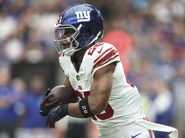 GLENDALE, ARIZONA - SEPTEMBER 17: Saquon Barkley #26 of the New York Giants runs with the ball during an NFL football game between the Arizona Cardinals and the New York Giants at State Farm Stadium on September 17, 2023 in Glendale, Arizona.