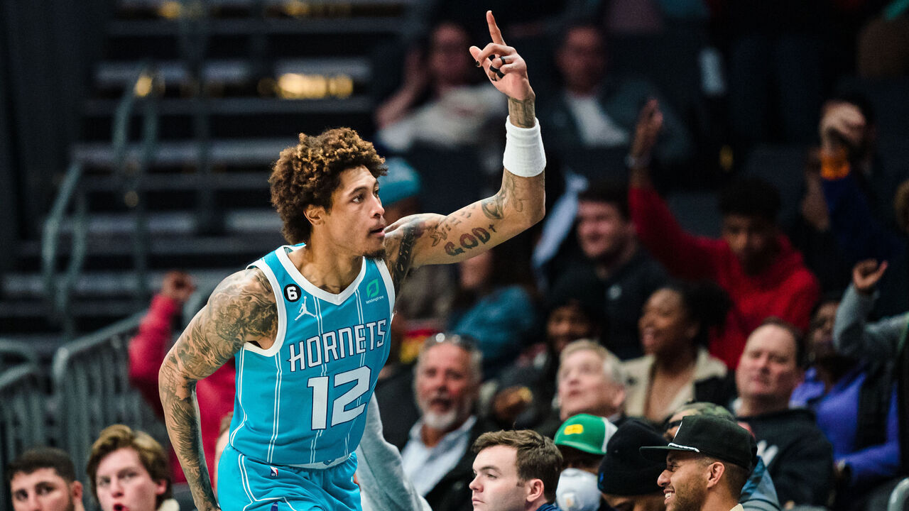 CHARLOTTE, NORTH CAROLINA - MARCH 20: Kelly Oubre Jr. #12 of the Charlotte Hornets reacts after making a 3-pointer in the third quarter during their game against the Indiana Pacers at Spectrum Center on March 20, 2023 in Charlotte, North Carolina.