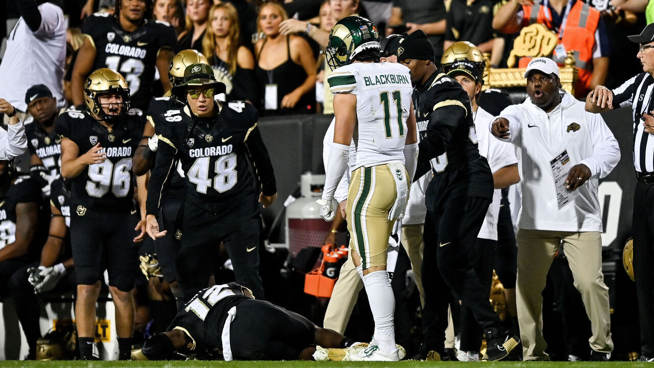 BOULDER, CO - SEPTEMBER 16: Coaches, teammates, and fans react after wide receiver Travis Hunter #12 of the Colorado Buffaloes was hit near the sideline on a pass attempt by defensive back Henry Blackburn #11 of the Colorado State Rams at Folsom Field on September 16, 2023 in Boulder, Colorado.