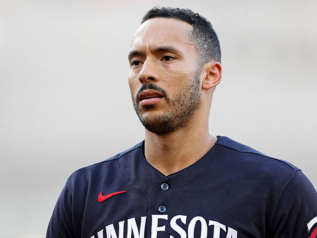 CLEVELAND, OHIO - SEPTEMBER 5: Carlos Correa #4 of the Minnesota Twins walks towards the dugout during the first inning against the Cleveland Guardians at Progressive Field on September 5, 2023 in Cleveland, Ohio.