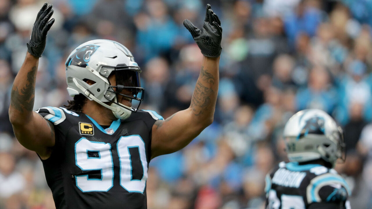 CHARLOTTE, NC - DECEMBER 24: Julius Peppers #90 of the Carolina Panthers reacts after a play against the Tampa Bay Buccaneers in the first quarter during their game at Bank of America Stadium on December 24, 2017 in Charlotte, North Carolina.