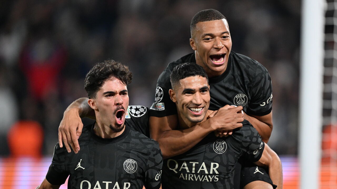 PARIS, FRANCE - SEPTEMBER 19: Hakimi of Paris Saint-Germain (PSG) celebrates with Vitinha (17) and Kylian Mbappe (R) after scoring a goal during the UEFA Champions League Group F football match between PSG and Borussia Dortmund at Parc des Princes in Paris, France on September 19, 2023.