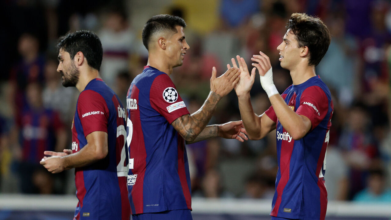 BARCELONA, SPAIN - SEPTEMBER 19: Joao Felix of FC Barcelona celebrates 5-0 with Ilkay Gundogan of FC Barcelona, Joao Cancelo of FC Barcelona during the UEFA Champions League match between FC Barcelona v Royal Antwerp at the Lluis Companys Olympic Stadium on September 19, 2023 in Barcelona Spain