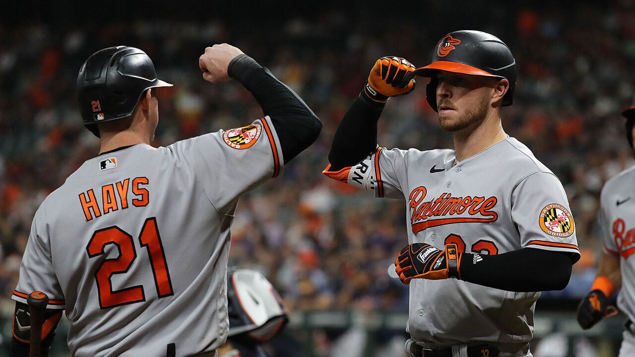 HOUSTON, TEXAS - SEPTEMBER 19: Ryan O'Hearn #32 of the Baltimore Orioles receives a high five from Austin Hays #21 after hitting a two run home run in the first inning at Minute Maid Park on September 19, 2023 in Houston, Texas.