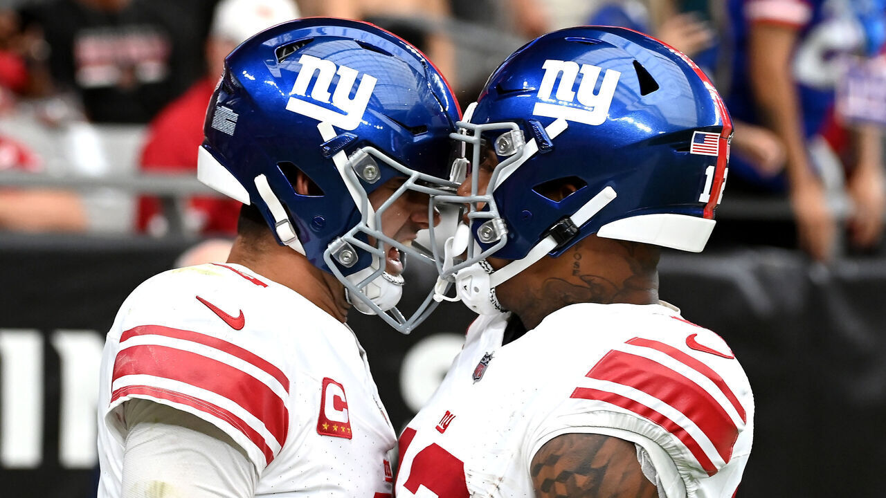 GLENDALE, ARIZONA - SEPTEMBER 17: Daniel Jones #8 of the New York Giants celebrates a touchdown with Darren Waller #12 against the Arizona Cardinals at State Farm Stadium on September 17, 2023 in Glendale, Arizona.