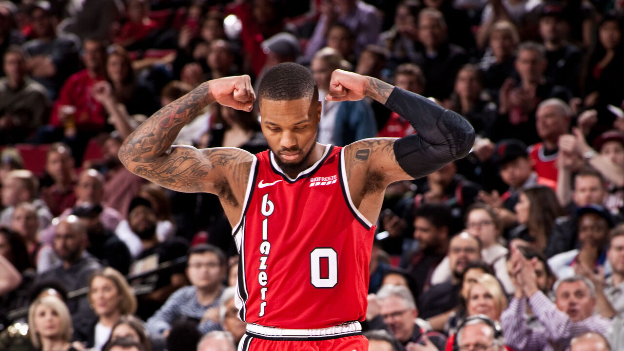 PORTLAND, OR - DECEMBER 20: Damian Lillard #0 of the Portland Trail Blazers flexes during the game against the Orlando Magic on December 20, 2019 at the Moda Center Arena in Portland, Oregon. Mandatory Copyright Notice: Copyright 2019 NBAE