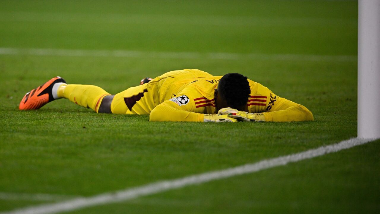Manchester United's Cameroonian goalkeeper #24 Andre Onana reacts after conceding the opening goal during the UEFA Champions League Group A football match FC Bayern Munich v Manchester United in Munich, southern Germany on September 20, 2023.