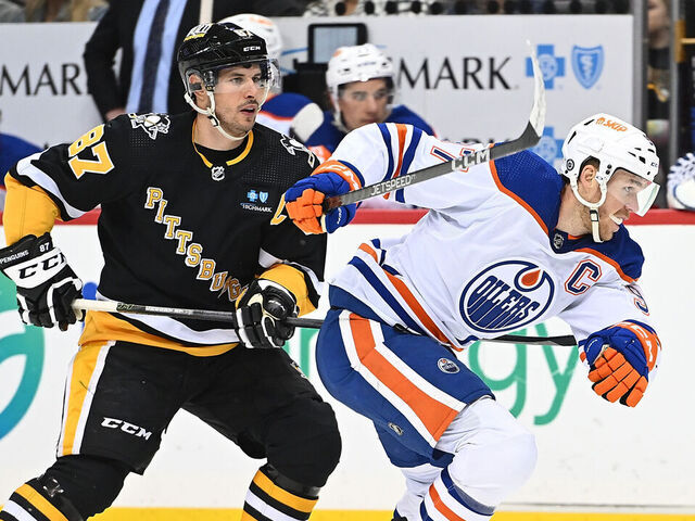 PITTSBURGH, PA - FEBRUARY 23: Connor McDavid #97 of the Edmonton Oilers skates against Sidney Crosby #87 of the Pittsburgh Penguins in the second period during the game at PPG PAINTS Arena on February 23, 2023 in Pittsburgh, Pennsylvania.