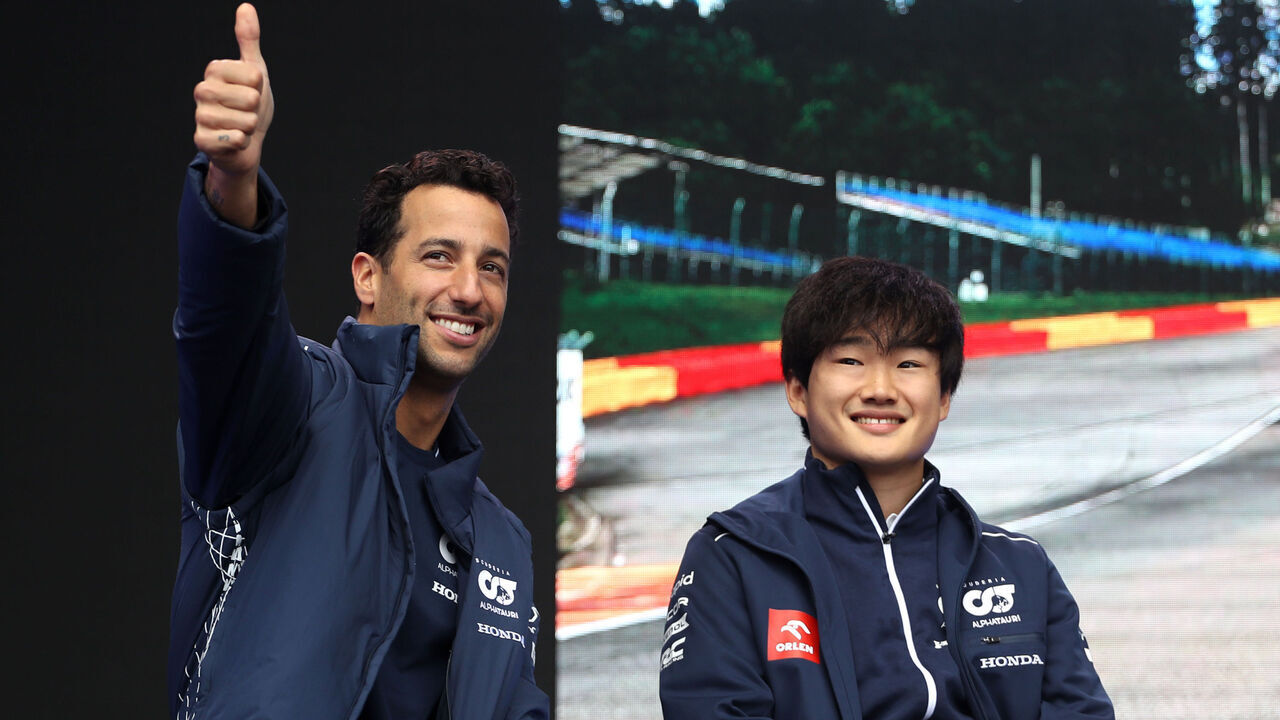 SPA, BELGIUM - JULY 28: Daniel Ricciardo of Australia and Scuderia AlphaTauri and Yuki Tsunoda of Japan and Scuderia AlphaTauri talk to the crowd on the fan stage prior to practice ahead of the F1 Grand Prix of Belgium at Circuit de Spa-Francorchamps on July 28, 2023 in Spa, Belgium.