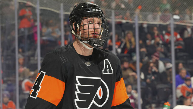 PHILADELPHIA, PA - DECEMBER 05: Sean Couturier #14 of the Philadelphia Flyers looks on against the Tampa Bay Lightning at the Wells Fargo Center on December 5, 2021 in Philadelphia, Pennsylvania. The Tampa Bay Lightning defeated the Philadelphia Flyers 7-1.