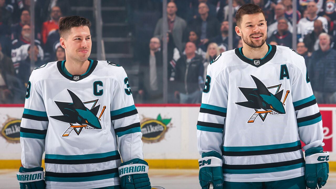 WINNIPEG, CANADA - APRIL 10: Logan Couture #39 and Tomas Hertl #48 of the San Jose Sharks are all smiles as they look on prior to puck drop against the Winnipeg Jets at the Canada Life Centre on April 10, 2023 in Winnipeg, Manitoba, Canada.