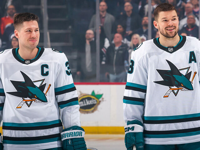 WINNIPEG, CANADA - APRIL 10: Logan Couture #39 and Tomas Hertl #48 of the San Jose Sharks are all smiles as they look on prior to puck drop against the Winnipeg Jets at the Canada Life Centre on April 10, 2023 in Winnipeg, Manitoba, Canada.