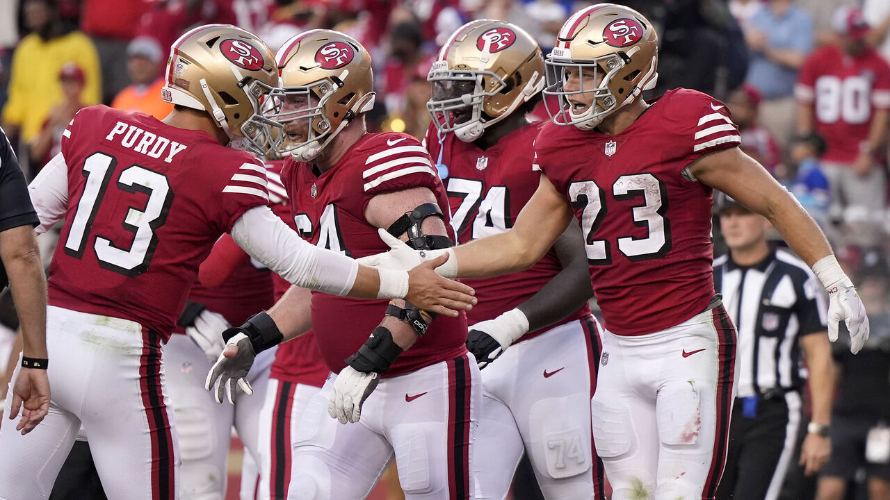 SANTA CLARA, CALIFORNIA - SEPTEMBER 21: Christian McCaffrey #23 of the San Francisco 49ers celebrates with Brock Purdy #13 after scoring a touchdown against the New York Giants during the second quarter in the game at Levi's Stadium on September 21, 2023 in Santa Clara, California.