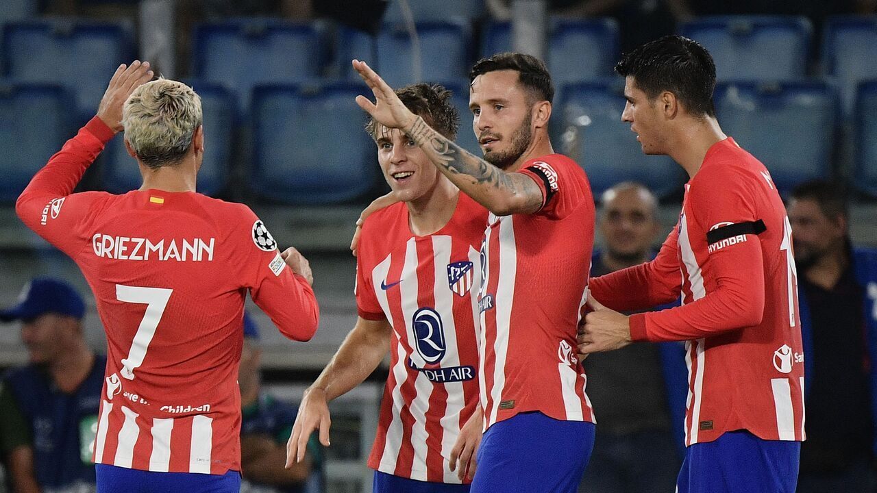 Atletico Madrid's Spanish midfielder #24 Pablo Barrios celebrates with teammates after scoring during the UEFA Champions League 1st round group E football match between Lazio and Atletico Madrid at the Olympic stadium in Rome on September 19, 2023.