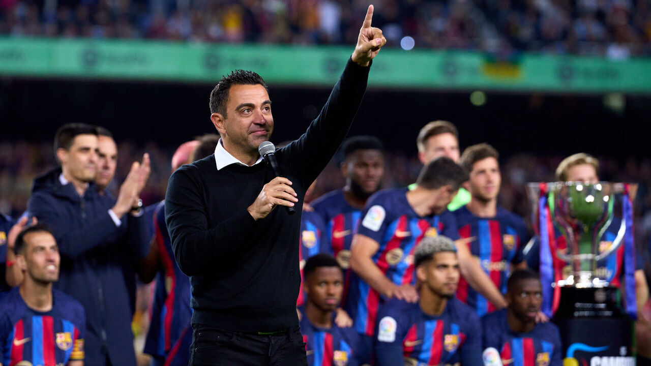 BARCELONA, SPAIN - MAY 20: Head Coach Xavi Hernandez of FC Barcelona speaks to the fans as players of FC Barcelona celebrate after being crowned LaLiga Santander Champions after the LaLiga Santander match between FC Barcelona and Real Sociedad at Spotify Camp Nou on May 20, 2023 in Barcelona, Spain.