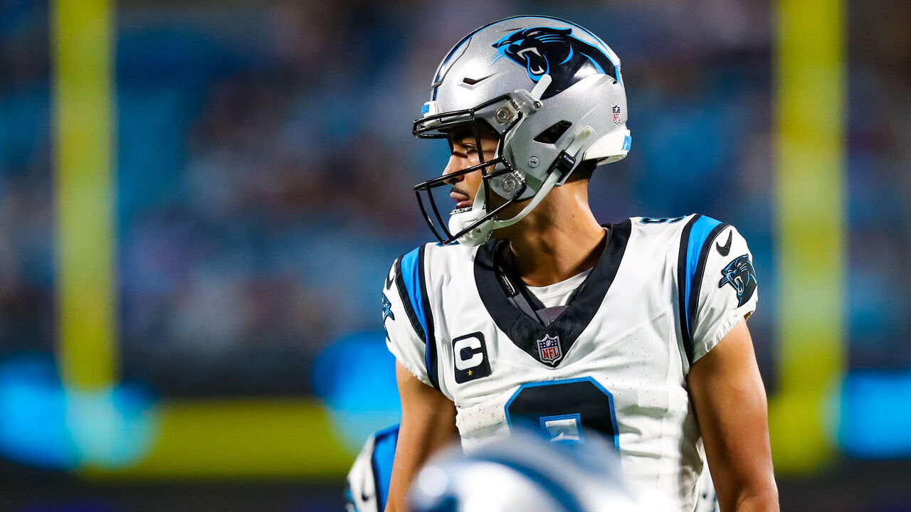 CHARLOTTE, NC - SEPTEMBER 18: Bryce Young #9 of the Carolina Panthers takes a call from the sideline during a football game against the New Orleans Saints at Bank of America Stadium in Charlotte, North Carolina on Sep 18, 2023.